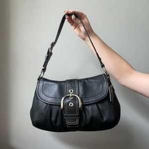 Coach shoulder bag with magnetic buckle closure